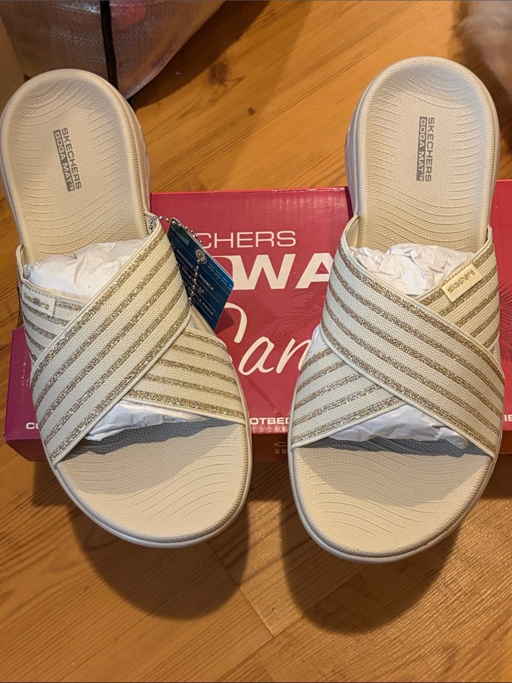 Skechers Women's Cream Slide Sandals with Gold Stripe Cross Straps